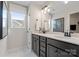 Bright bathroom with double vanity, modern fixtures, and white marble flooring at 2010 Puddle Pond Rd, Indian Trail, NC 28079