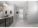 Well-lit bathroom with double vanity, glass shower, and modern design at 2010 Puddle Pond Rd, Indian Trail, NC 28079