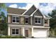 Charming new construction home with siding, shutters, and a two-car garage at 2010 Puddle Pond Rd, Indian Trail, NC 28079