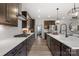 Bright kitchen boasts stainless appliances, long counters, and stylish modern fixtures at 2010 Puddle Pond Rd, Indian Trail, NC 28079