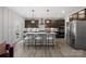 Elegant kitchen features a large central island with barstool seating and pendant lighting at 2010 Puddle Pond Rd, Indian Trail, NC 28079