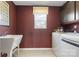 Modern laundry room with a large basin sink, washer and dryer and tile floors at 2010 Puddle Pond Rd, Indian Trail, NC 28079