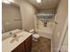 Well-lit bathroom featuring a vanity, toilet, and bathtub with shower curtain at 2026 Talbot Ln, Hickory, NC 28602