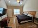 Spacious bedroom with high ceilings, a ceiling fan, a window, and a comfortable bed at 2026 Talbot Ln, Hickory, NC 28602