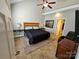 Bedroom with high ceilings, large bed, bedside tables, and neutral tones at 2026 Talbot Ln, Hickory, NC 28602