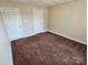 Bedroom with neutral walls, carpet and white trim at 2026 Talbot Ln, Hickory, NC 28602