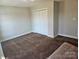 Empty bedroom featuring neutral walls and carpet, ready for personalization at 2026 Talbot Ln, Hickory, NC 28602