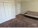 Spacious bedroom with a closet and space for customizable furniture arrangements at 2026 Talbot Ln, Hickory, NC 28602