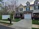 Charming townhome with a well-maintained lawn, a one car garage, and a welcoming front entrance at 2026 Talbot Ln, Hickory, NC 28602