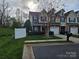 Inviting townhome featuring a well-manicured lawn, a single-car garage, and a cozy front porch at 2026 Talbot Ln, Hickory, NC 28602