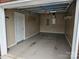 An empty garage with painted floors and shelving for storage at 2026 Talbot Ln, Hickory, NC 28602