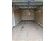 An empty garage with painted floors and shelving for storage at 2026 Talbot Ln, Hickory, NC 28602