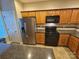 Well-equipped kitchen featuring stylish cabinetry, dark countertops, and modern appliances at 2026 Talbot Ln, Hickory, NC 28602