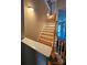 Well-lit staircase with wooden steps and white risers leading to the upper level at 2026 Talbot Ln, Hickory, NC 28602