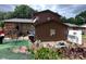 The backyard features decorative flower beds, a brick patio and privacy at 204 Aspen Dr, Gastonia, NC 28052