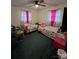 Shared bedroom with two beds, matching linens and pink accents at 204 Aspen Dr, Gastonia, NC 28052
