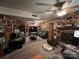 Living room with dual reclining couches, wood-paneled walls, and fireplace at 204 Aspen Dr, Gastonia, NC 28052