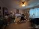 Spacious main bedroom with a ceiling fan, natural light, and ample closet space at 204 Aspen Dr, Gastonia, NC 28052