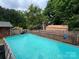 Spacious above-ground pool nestled within a fully fenced backyard, offering privacy at 204 Aspen Dr, Gastonia, NC 28052
