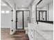 Bathroom with dual sink vanity, framed mirror, glass shower and updated hardware at 2075 Fordhill St, Rock Hill, SC 29732