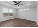 Bright bedroom features a ceiling fan, neutral walls, hardwood floors and large windows at 2075 Fordhill St, Rock Hill, SC 29732