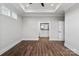 Bedroom boasts trey ceiling, ceiling fan, hardwood floors and ensuite bathroom at 2075 Fordhill St, Rock Hill, SC 29732