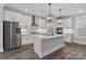 Modern kitchen with stainless steel appliances, white cabinets, and a large island, perfect for entertaining at 2075 Fordhill St, Rock Hill, SC 29732