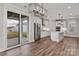 Modern kitchen with white cabinets, stainless steel appliances, an island, and a view of the backyard at 2075 Fordhill St, Rock Hill, SC 29732