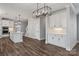 Open-concept kitchen with a central island, white cabinetry, stainless steel appliances, and modern lighting at 2075 Fordhill St, Rock Hill, SC 29732