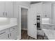 Kitchen area featuring stainless steel double oven, pantry, white cabinets and stone countertops at 2075 Fordhill St, Rock Hill, SC 29732