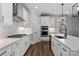 Bright kitchen with white cabinets, stainless steel appliances, and a large island with counter seating at 2075 Fordhill St, Rock Hill, SC 29732
