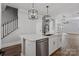 Kitchen island with stainless steel dishwasher, white cabinets, and overhead lighting at 2075 Fordhill St, Rock Hill, SC 29732