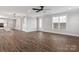 Bright and open living area with wood flooring, white trim, and large windows with plenty of natural light at 2075 Fordhill St, Rock Hill, SC 29732