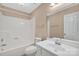 All-white bathroom features a tub/shower, vanity, toilet, and a large mirror at 212 Pointe Cir, Rock Hill, SC 29732