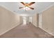 Spacious living room with carpet flooring, ceiling fan, and connections to other rooms at 212 Pointe Cir, Rock Hill, SC 29732