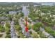 Stunning aerial view of waterfront community with lush trees, near the lake and marina at 21203 Harken Dr, Cornelius, NC 28031