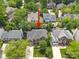 Aerial view of beautiful home with mature trees and landscaping in a well-maintained community at 21203 Harken Dr, Cornelius, NC 28031