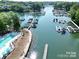 Aerial view of waterfront community with private pool and a large marina on the lake at 21203 Harken Dr, Cornelius, NC 28031