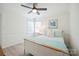 Inviting bedroom with coastal decor, natural light, and a ceiling fan for added comfort at 21203 Harken Dr, Cornelius, NC 28031