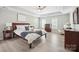 Spacious primary bedroom with tray ceilings, a ceiling fan, and plenty of natural light at 21203 Harken Dr, Cornelius, NC 28031