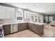Bright kitchen with modern cabinetry, stainless steel dishwasher, and hardwood flooring at 21203 Harken Dr, Cornelius, NC 28031