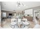 Open-concept living area with dining table, comfortable seating, and modern decor at 21203 Harken Dr, Cornelius, NC 28031