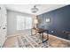 Bright office space with modern gray accent wall and wood floors is great for remote work at 21203 Harken Dr, Cornelius, NC 28031