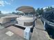 View of pontoon boat, with cover, docked in a marina, emphasizing its potential for waterfront enjoyment at 21203 Harken Dr, Cornelius, NC 28031