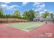 Tennis court surrounded by lush landscaping near the community center at 21203 Harken Dr, Cornelius, NC 28031