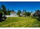 Large, well-maintained backyard with lush green grass and a trampoline, ideal for outdoor fun and recreation at 217 Hydrangea Dr, Clover, SC 29710