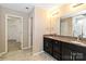 Bright bathroom with a double sink vanity featuring granite countertop and modern fixtures at 217 Hydrangea Dr, Clover, SC 29710