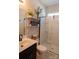 Updated bathroom with modern sink, sliding glass shower door, and decorative shelving at 217 Hydrangea Dr, Clover, SC 29710