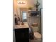 Charming bathroom featuring a vanity, a toilet with decorative shelving, and a glass enclosed shower at 217 Hydrangea Dr, Clover, SC 29710