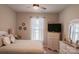 Comfortable bedroom featuring a ceiling fan, a chest of drawers, and lots of natural light at 217 Hydrangea Dr, Clover, SC 29710